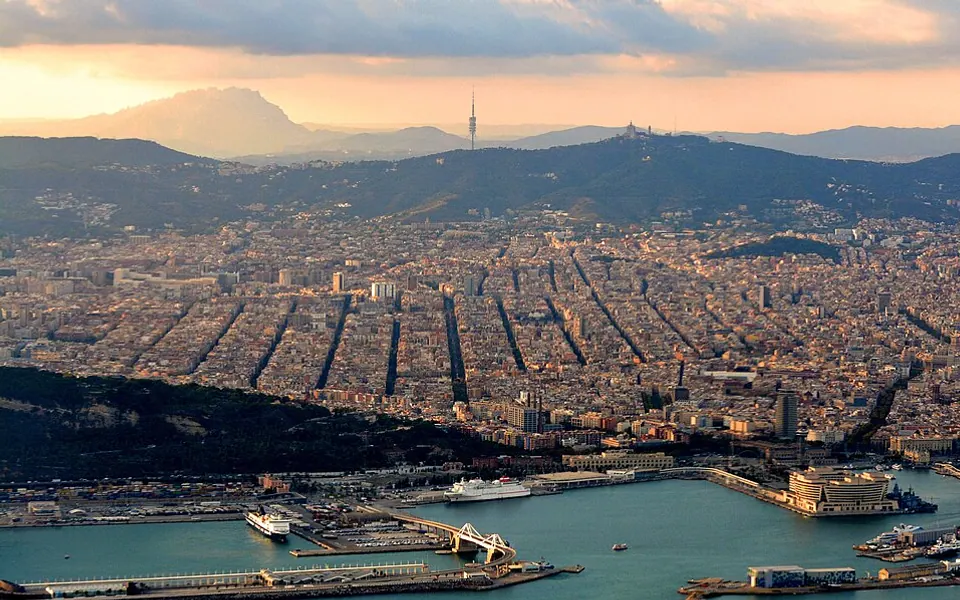 With part of the Port of Barcelona in the foreground and Montserrat Mountain at top left