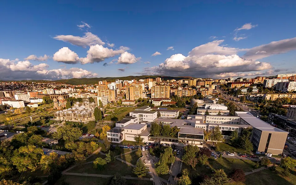 East side of Prishtina city. Middle to the left of picture the National Library and its famous architectural design. In the backdrop the Germia hills can be seen.
